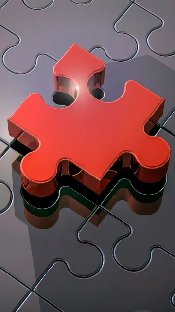 Red Puzzle Piece on Gray Background
