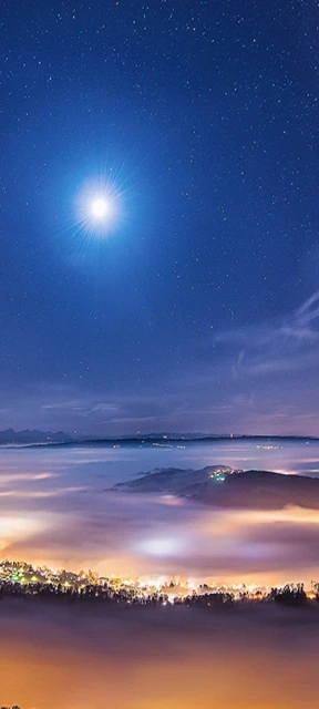 Bright Moon Over Cloudy Mountain Cityscape