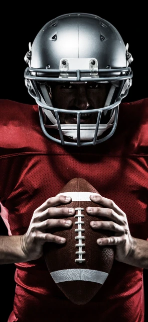 Football Player Holding Ball