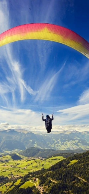 Paraglider in blue sky
