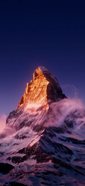 Snowy Mountain Peak at Sunset
