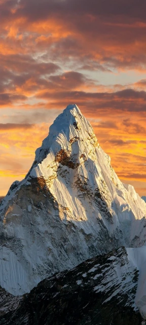 Snowy mountain peak sunset