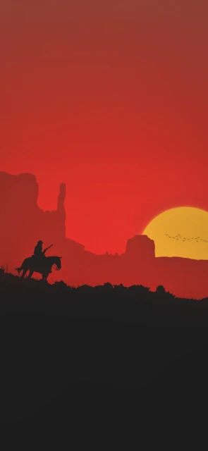 Silhouette of Cowboy on Horseback at Sunset