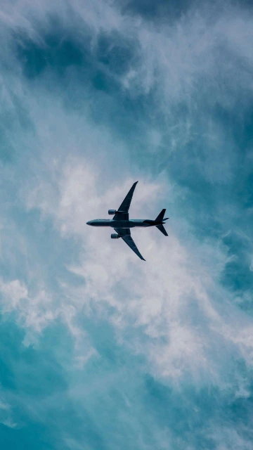 Airplane Flying in Dark Clouds