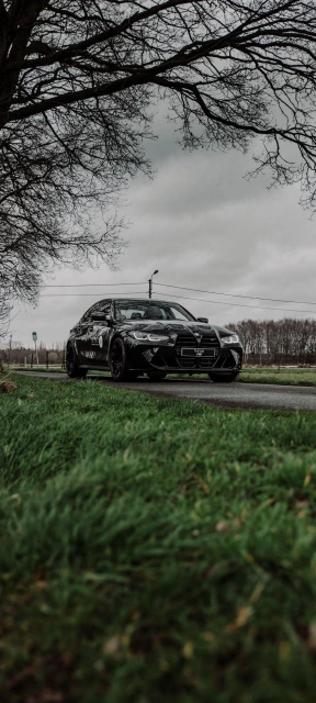 Black BMW M3 on Rural Road