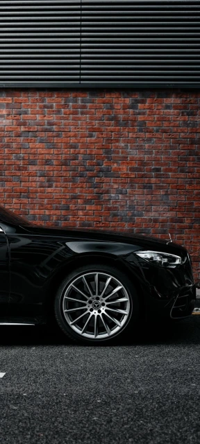 Black Car Wheel Brick Wall