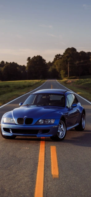Blue BMW on Country Road