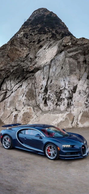 Blue Bugatti Car in Front of Mountain