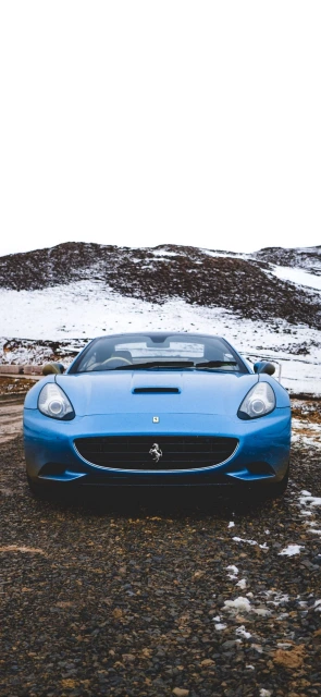 Blue Ferrari Car in Snow