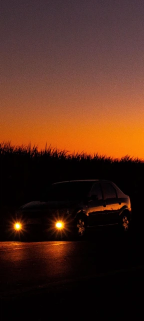 Car Headlights at Sunset