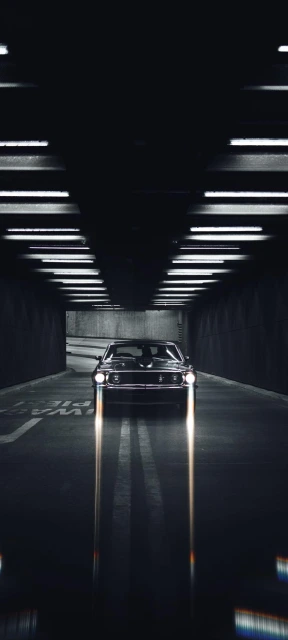Car in Tunnel With Headlights