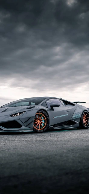 Grey Sports Car With Orange Wheels