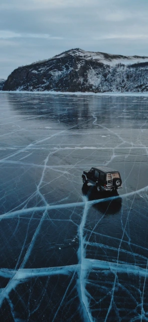 Jeep on Cracked Frozen Lake