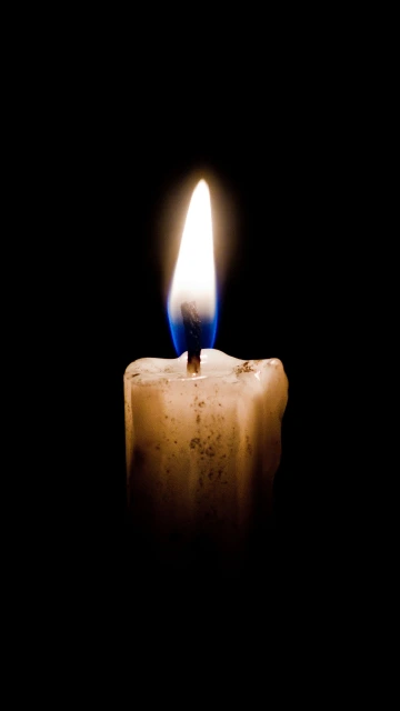 Lit Candle in Dark