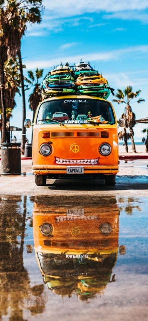 Orange Van Reflection in Puddle