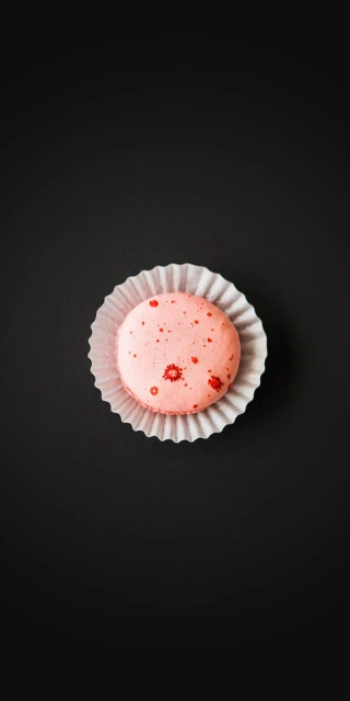 Pink Macaron on Black Background