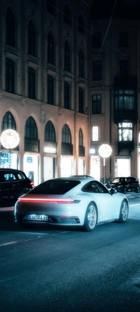 Porsche on City Street at Night