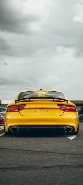Rear View of Yellow Car