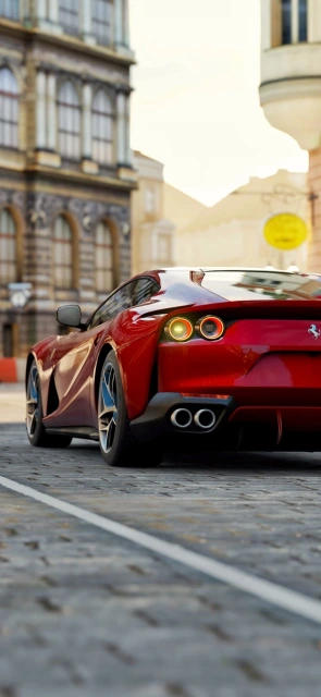 Red Ferrari Rear View Cobblestone Street