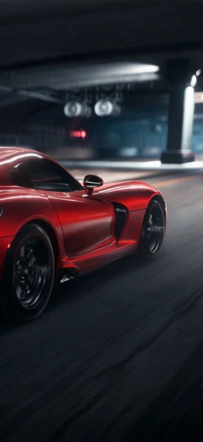Red Sports Car Driving at Night