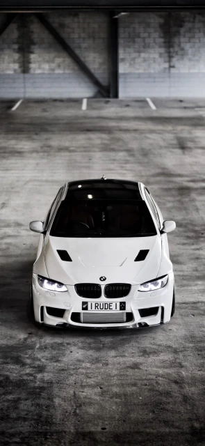 White BMW Car in Parking Garage