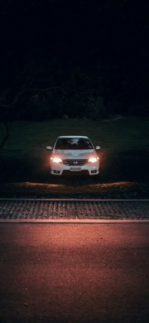 White Car Headlights at Night