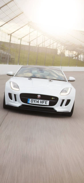 White Jaguar F Type on Racetrack
