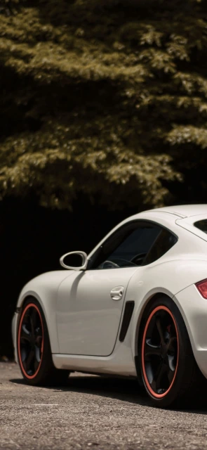 White Sports Car With Orange Rims