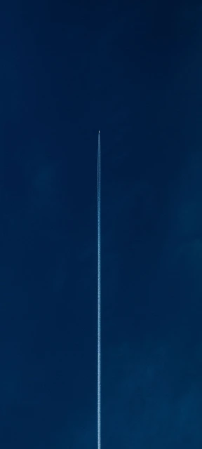 Airplane Contrail in Blue Sky