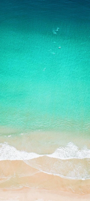 Aerial View of Turquoise Ocean and Beach