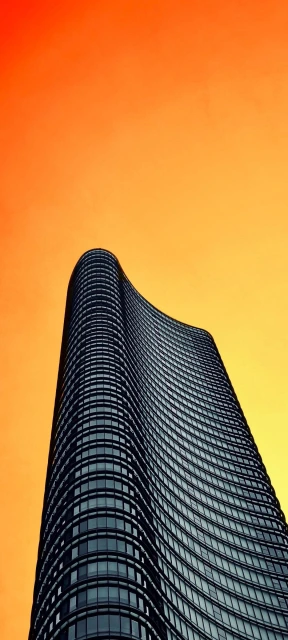 Curved Skyscraper at Sunset