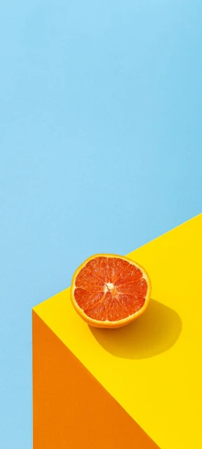 Half Orange on Yellow and Blue Background
