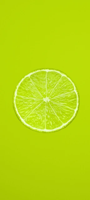 Lime Slice on Green Background