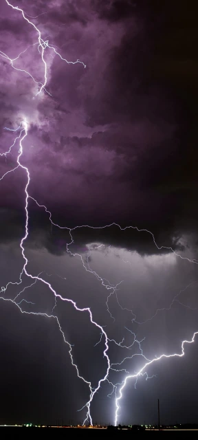 Multiple Lightning Strikes Purple Storm Clouds