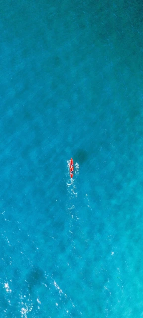 Red Kayak on Blue Water