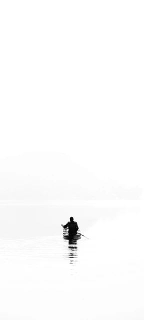 Solo Fisher on Calm Water