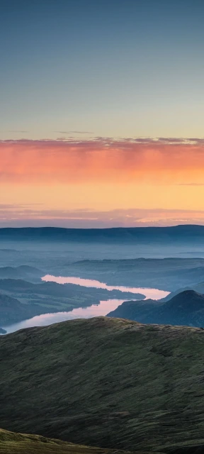 Sunset Over Hills and Lake