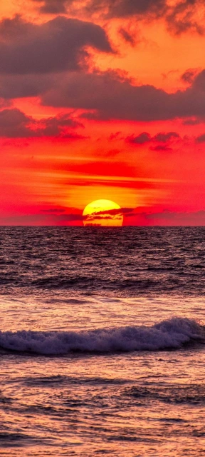 Sunset Over Ocean With Red Sky