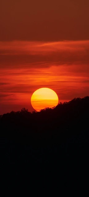 Orange Sunset Over Hill Silhouette