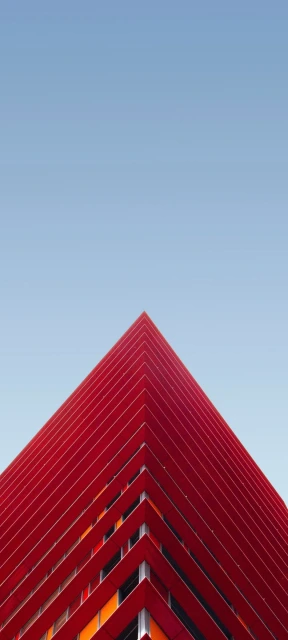 Red Building Corner Against Blue Sky