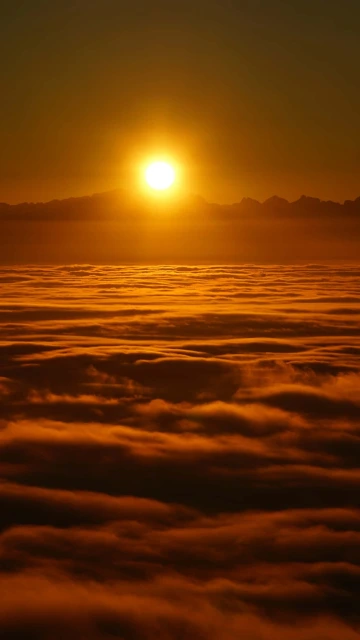 Sunset Over Clouds