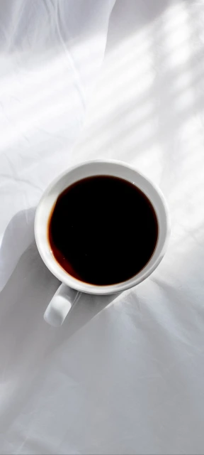 White Coffee Cup With Dark Liquid