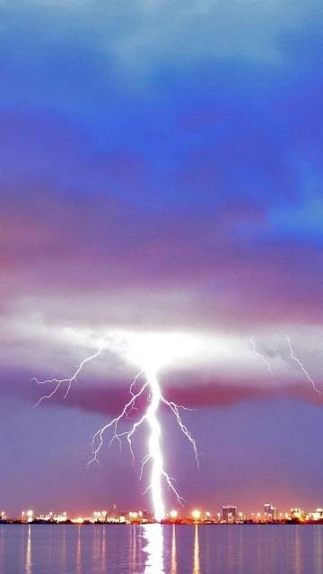 Lightning Strike Over City Skyline
